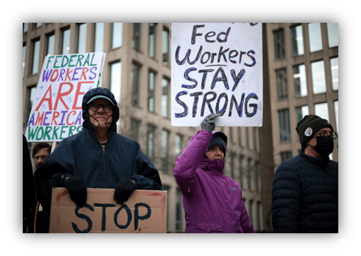 Federal workers protest, holding signs that advocate for their rights and solidarity.