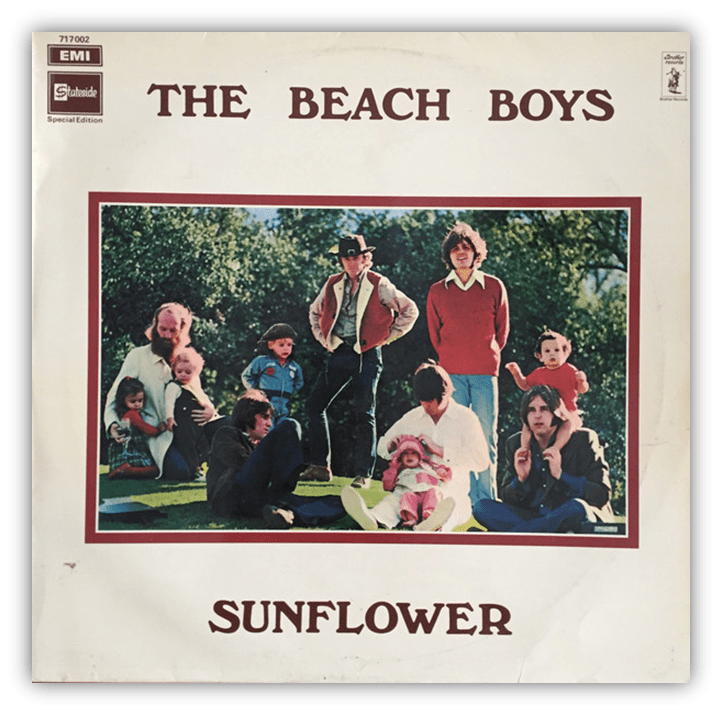 Alt text: "The Beach Boys album cover for 'Sunflower' featuring the band and children in a garden setting."