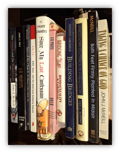 Books on a shelf, including titles on faith, LGBTQ+ issues, and social justice.