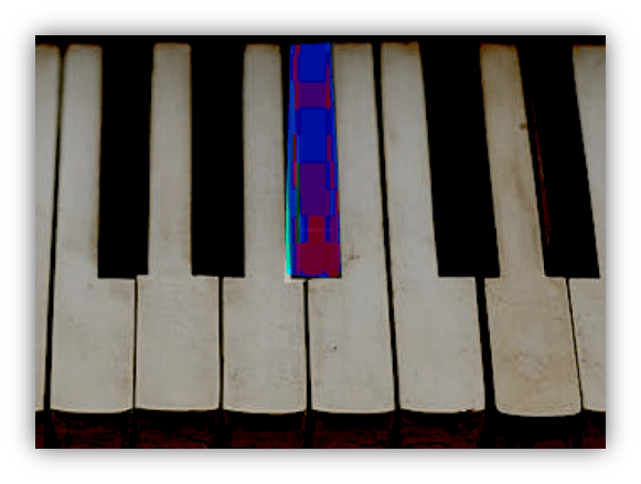 "Close-up of piano keys with colorful overlay."