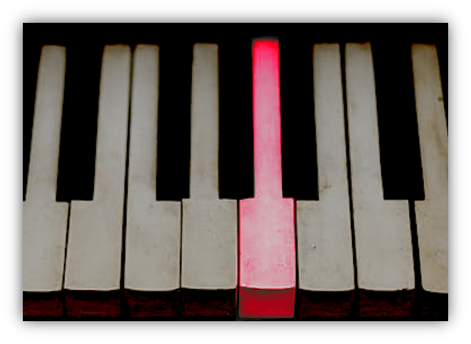 Red key highlighted on a piano keyboard.