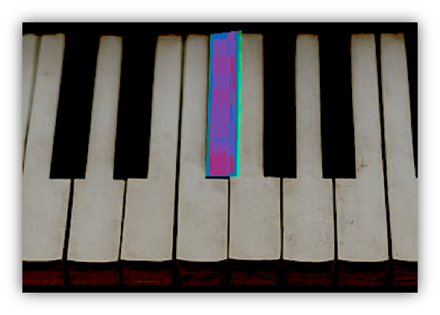 Close-up of piano keys with one highlighted key.
