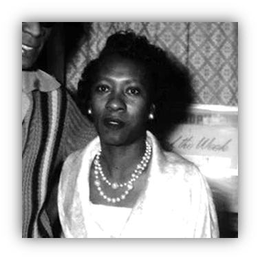 "Vintage black and white portrait of a woman wearing pearls and a stylish outfit."