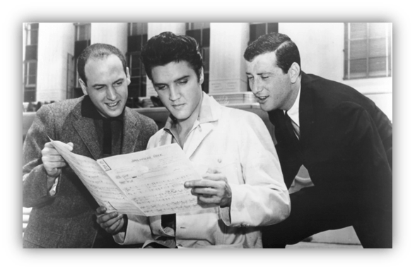 Elvis Presley reading music with two men, 1950s.