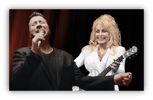 Dolly Parton performing with a male singer on stage.
