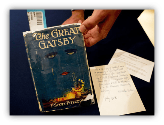 "Vintage edition of 'The Great Gatsby' by F. Scott Fitzgerald with a handwritten note."
