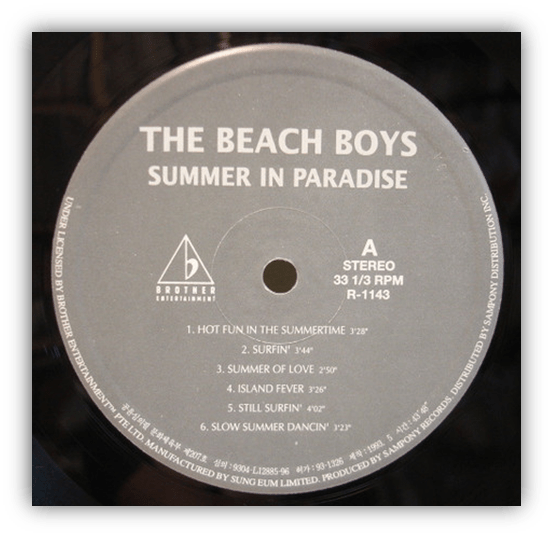 Vinyl record label of "Summer in Paradise" by The Beach Boys featuring tracklist and album details.