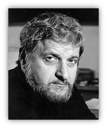 Black and white portrait of a man with a beard, looking thoughtfully at the camera.