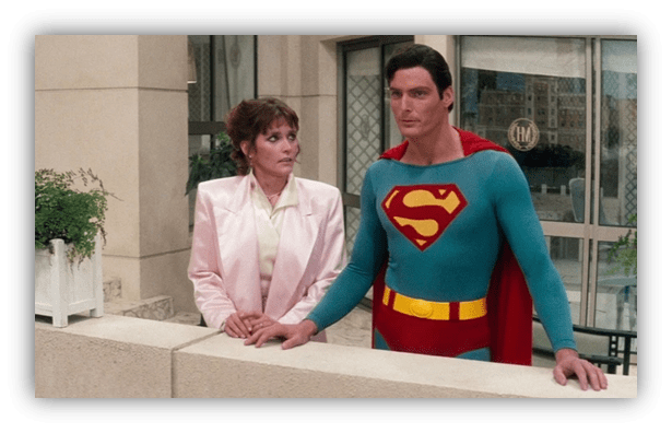 "Superman and Lois Lane at a balcony, iconic movie scene."