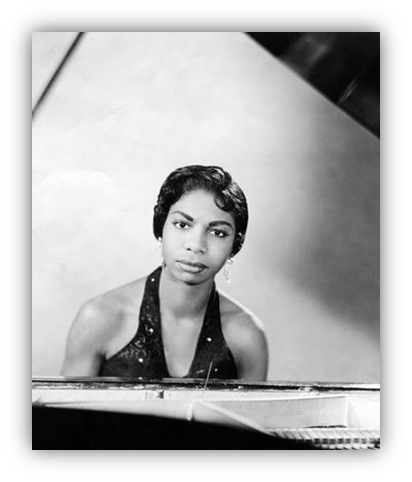 "Vintage black and white image of a female pianist at a grand piano, exuding elegance and talent."