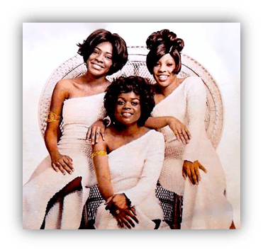 "Three women in elegant white dresses posing together, showcasing vintage fashion and friendship."