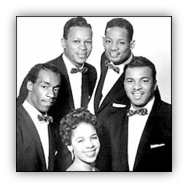 "Vintage black and white photo of a singing group with five members, dressed in formal attire."