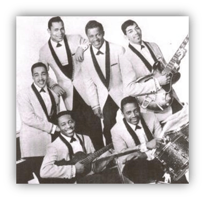 "Vintage photo of a six-member musical group dressed in tuxedos, posing with instruments."