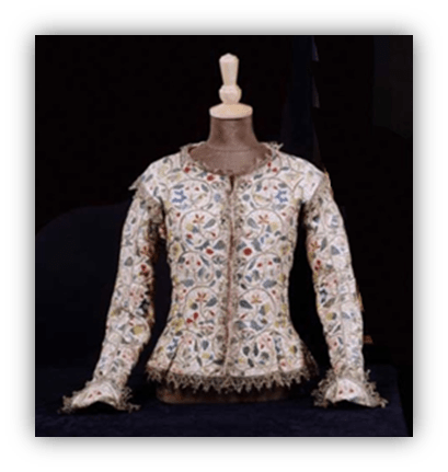 "Embroidered vintage jacket displayed on a mannequin."