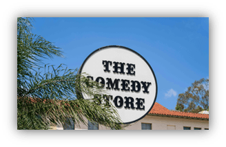 Alt text: "Sign of The Comedy Store against a clear blue sky."