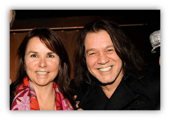 "Smiling couple posing together at an event, showcasing friendly atmosphere."