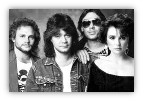 Black and white photo of a 1980s music band featuring four members.