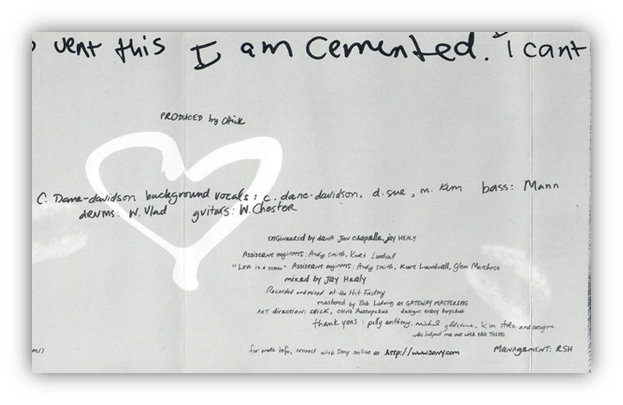 "Handwritten music credits and production details on a paper background."
