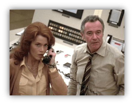 "Concerned woman on phone with man in office setting."