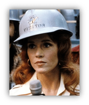 "Actress in a visitor helmet, speaking into a microphone."