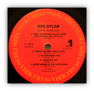 "Bob Dylan's 'Empire Burlesque' vinyl record label with tracklist."