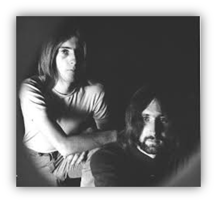 Black and white photo of two musicians posing together.