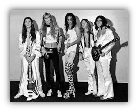 "Vintage rock band posing in black and white, showcasing iconic 70s fashion and instruments."