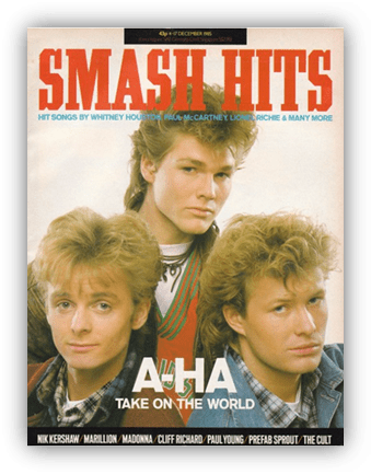 "Smash Hits magazine cover featuring A-ha, December 1985, showcasing popular music artists."