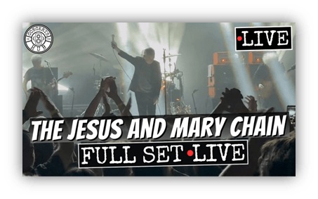 Alt text: "The Jesus and Mary Chain performing live, full set, with audience cheering."