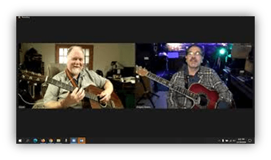 Two musicians playing acoustic guitars on a video call.