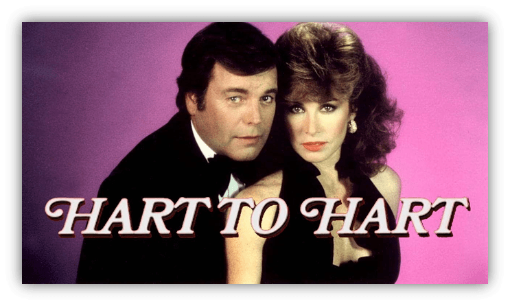 "Classic TV show 'Hart to Hart' featuring a couple in elegant attire against a pink background."