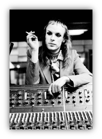 "Black and white photo of a musician at a mixing console, smoking a cigarette."